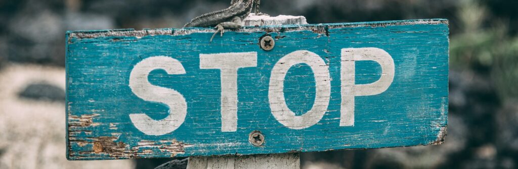 selective focus photography of stop road sign